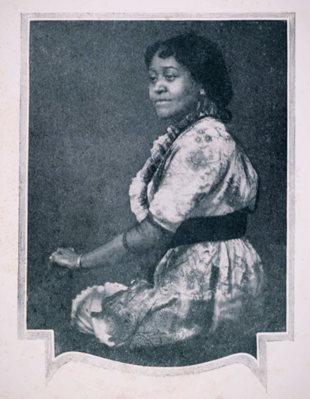 Annie Turnbo Malone seated in a portrait from a 1920 Poro College booklet